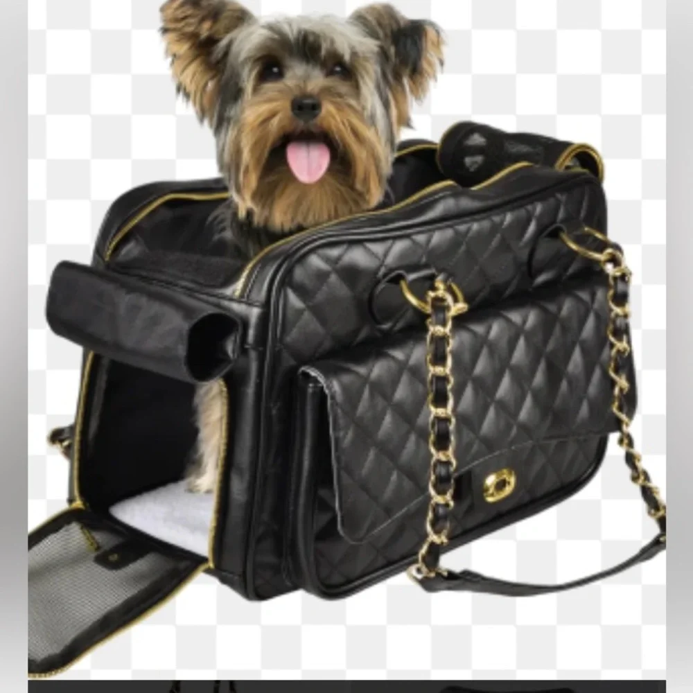 black quilted pet carrier tote with gold chain handles.